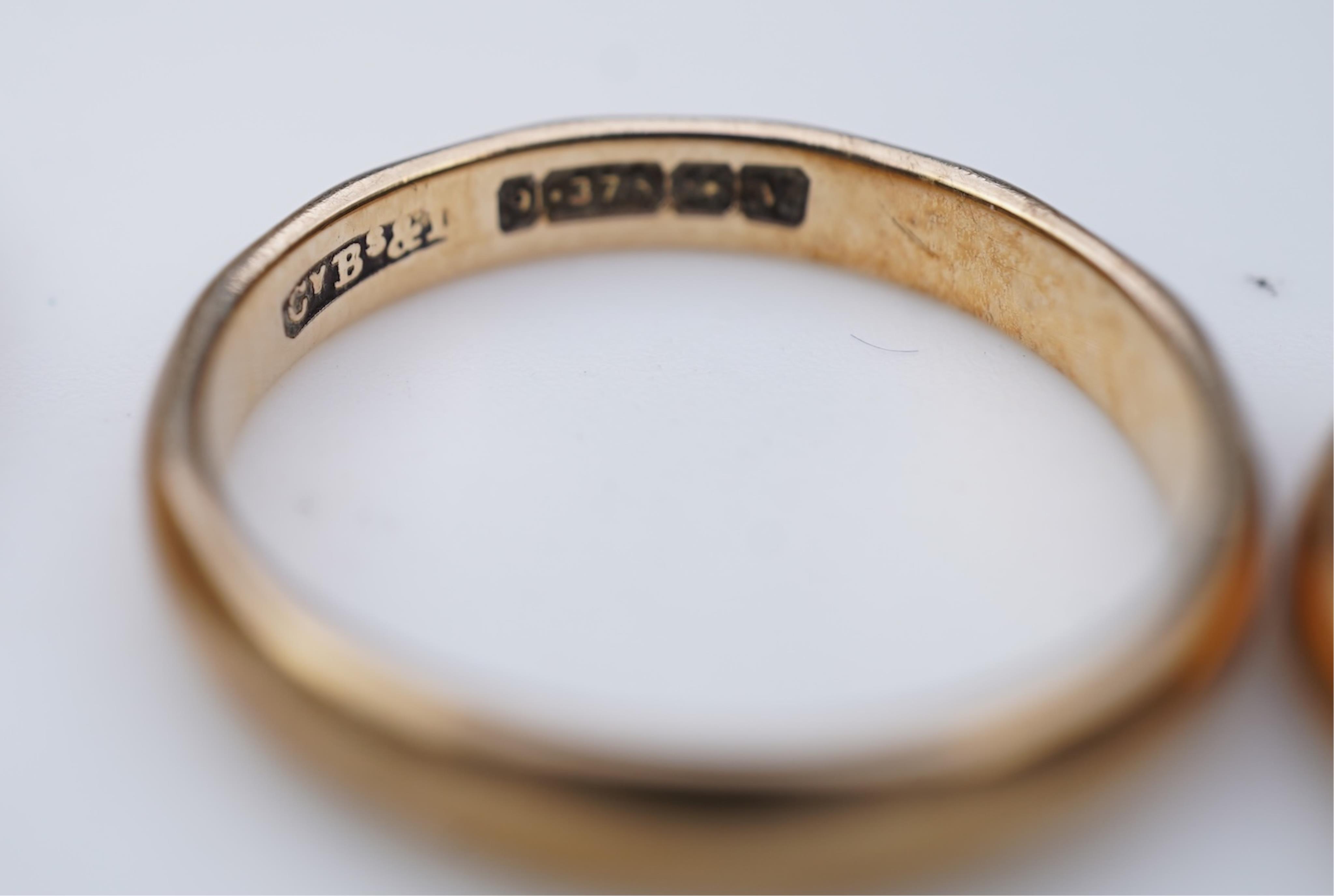 A collection of six gold wedding bands